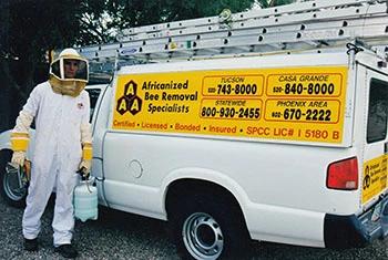 Surprise bee removal service truck and employee